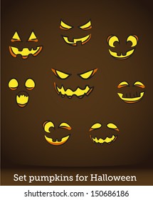 Jack o lantern pumpkin faces glowing on brown background