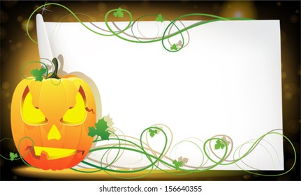 Jack o' Lantern and sheet of paper on abstract sparkling  background