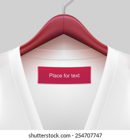 Jacket with label hanging on a hanger. The template for your design or advertising messages.