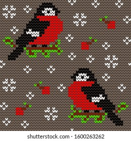 Jacquard knitted seamless pattern with cute bullfinchies, rowanberries and snowflakes. Winter background with nature and birds. Scandinavian style. Vector illustration.