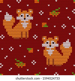 Jacquard knitted seamless pattern with foxes and rowanberries. Winter background with nature and animals. Scandinavian style. Vector illustration.