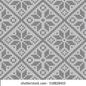 Jacquard knitted seamless pattern. Grey and white background. Scandinavian winter style. Vector illustration.