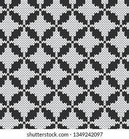 Jacquard knitted seamless pattern. White rhombus on black background.  Graphical vector illustration.