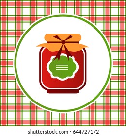 Jam jar isolated on kitchen towel checkered background. 