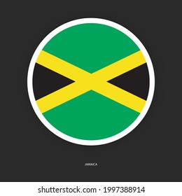 Jamaica circle flag with white border on dark grey background. Jamaica button flag with shadow isolated on barely dark background.