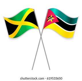 Jamaican and Mozambican crossed flags. Jamaica combined with Mozambique isolated on white. Language learning, international business or travel concept.