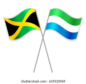 Jamaican and Sierra Leonean crossed flags. Jamaica combined with Sierra Leone isolated on white. Language learning, international business or travel concept.