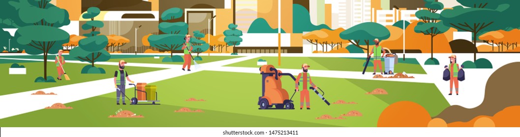 janitors team gathering trash cleaners using vacuum cleaner rack and broom streets cleaning service concept mix race people working in city urban park cityscape background full length horizontal