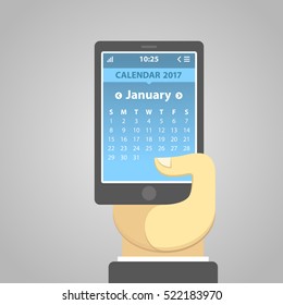 January 2017, weeks start from Sunday. Vector illustration of a smartphone holding in a hand, with a calendar on the screen. Simple UI in flat design