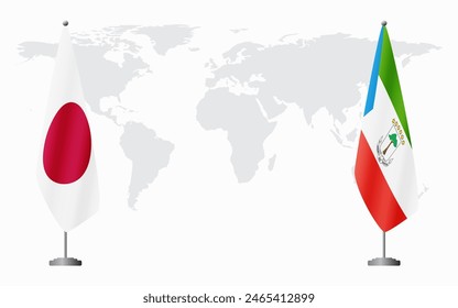 Japan and Equatorial Guinea flags for official meeting against background of world map.