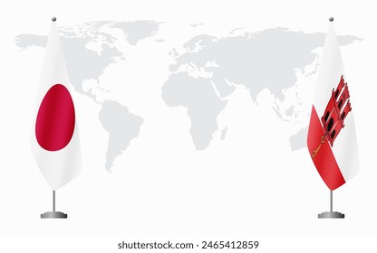 Japan and Gibraltar flags for official meeting against background of world map.