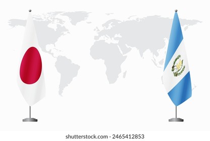 Japan and Guatemala flags for official meeting against background of world map.