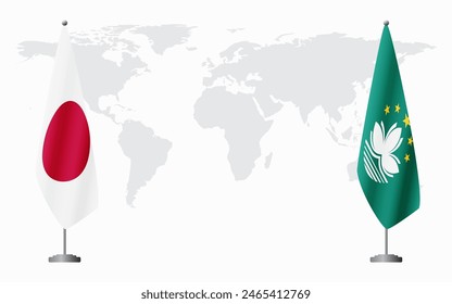 Japan and Macau flags for official meeting against background of world map.