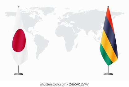 Japan and Mauritius flags for official meeting against background of world map.
