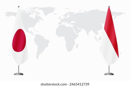 Japan and Monaco flags for official meeting against background of world map.