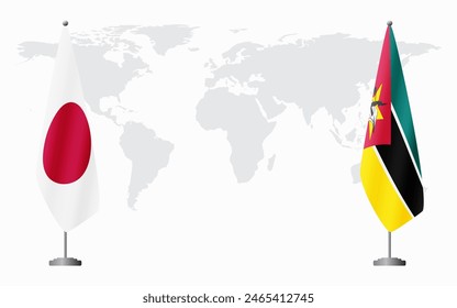 Japan and Mozambique flags for official meeting against background of world map.