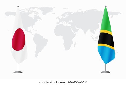 Japan and Tanzania flags for official meeting against background of world map.