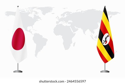 Japan and Uganda flags for official meeting against background of world map.