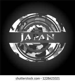 Japan written on a grey camouflage texture