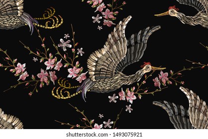 Japanese crane bird and sakura flowers seamless pattern. Embroidery Japan style. Asian ethnic template for clothes, t-shirt design 