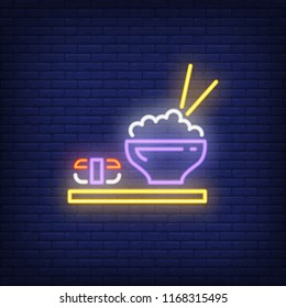 Japanese dishes with sushi and rice neon sign. Food, restaurant, Japanese cuisine. Advertisement design. Night bright neon sign, colorful billboard, light banner. Vector illustration in neon style.