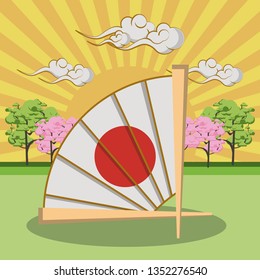 Japanese hand fan in landscape
