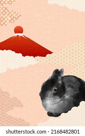 Japanese New Year card for the year of the Rabbit 2023, Japanese pattern background with black rabbit and red Fuji, first sunrise and sea of clouds.