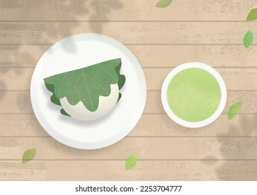 Japanese rice cake wrapped in an oak leaf and green tea for Children's Day