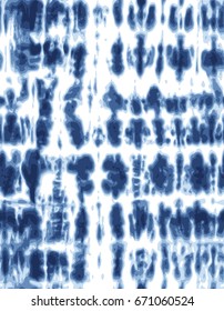 Japanese Shibori technique tie dye textile pattern in indigo blue. Editable vector seamless pattern repeat.