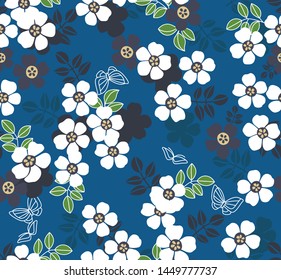 Japanese white cherry blossom pattern on blue seamless background