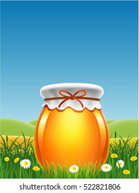 jar of honey in a meadow with flowers and place for text
