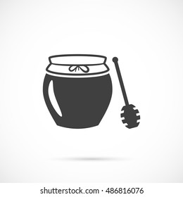 Jar of honey with wooden stick icon