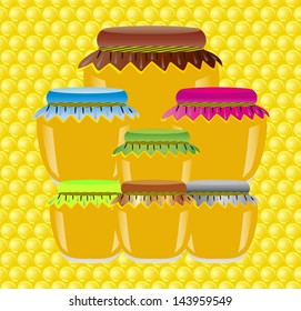 jars of honey on a background texture of a honeycomb
