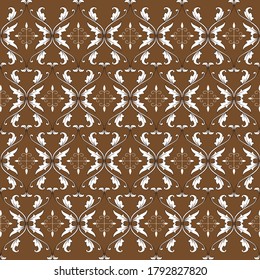 Javanese batik art work with unique flower motif and dark brown color design.
