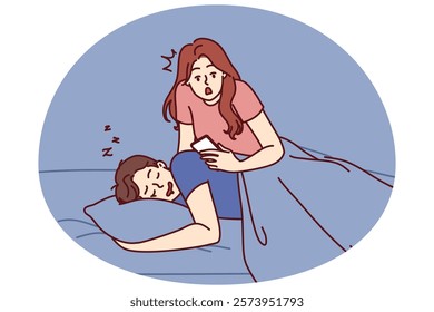 Jealous woman reads SMS in phone of boyfriend sleeping in bed and spies on husband checking incoming calls. Jealous wife does not trust partner due to relationship problems or regular cheating