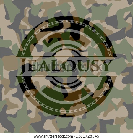 Jealousy written on a camouflage texture