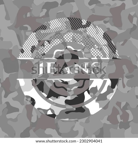 Jeans on grey camouflaged texture 