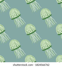 Jellyfish doodle silhouettes seamless pattern. Stylized aqua marine print with green exotic animal ornament and pale pastel blue background. For wallpaper, textile, wrapping paper, fabric print.