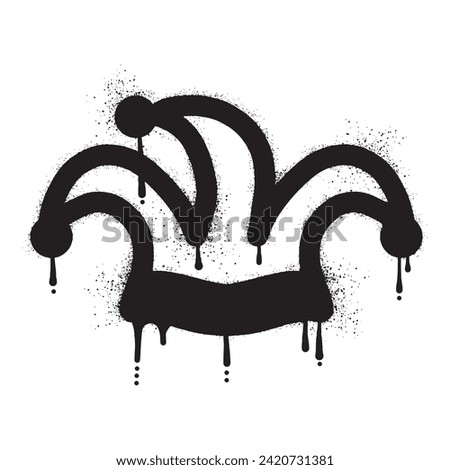 Jester hat graffiti drawn with black spray paint