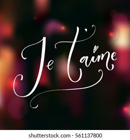 Je'taime. French phrase means I love you. Romantic saying, modern calligraphy. Vector quote on dark blur background with lights