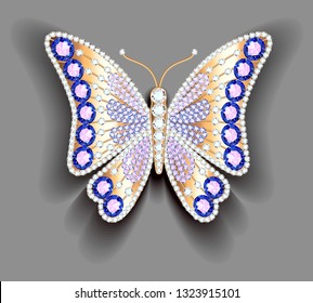 Jewelry gold butterfly in gems. Beautiful decoration.