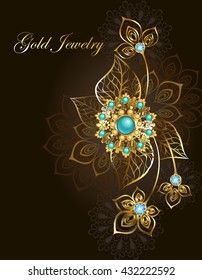 Jewelry gold jewelry made in oriental style, decorated with turquoise on dark, brown background.