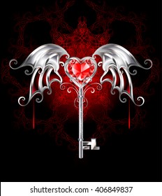 Jewelry key with a ruby heart, vampire and silver wings on dark patterned background.