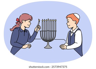 Jewish children stand near minora with burning candles, preparing for traditional holiday hanukkah. Boy in kippah and girl from israel celebrating onset hanukkah, showing commitment to traditions