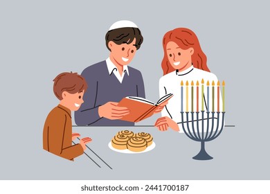 Jewish family celebrates day of hanukkah and reads holy book together, standing near table and minors. Jewish mom and dad read encyclopedia to little son, talking about traditions of people of israel