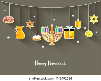 Jewish holiday Hanukkah with menorah (traditional Candelabra), donut and wooden dreidel (spinning top), coins, and stars.