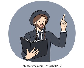 Jewish man holds book with religious texts and points finger up talking about israelite religion. Jewish priest and righteous guy in hat reads torah and looks at display with positive emotions