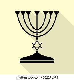 Jewish Menorah candlestick in black silhouette. Black icon with flat style shadow path on cream background.
