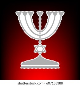 Jewish Menorah candlestick in black silhouette. Postage stam or old photo style on red-black gradient background.