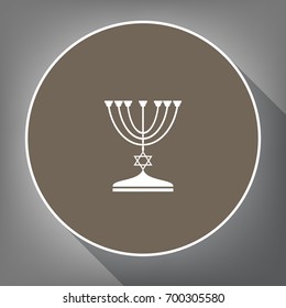 Jewish Menorah candlestick in black silhouette. Vector. White icon on brown circle with white contour and long shadow at gray background. Like top view on postament.